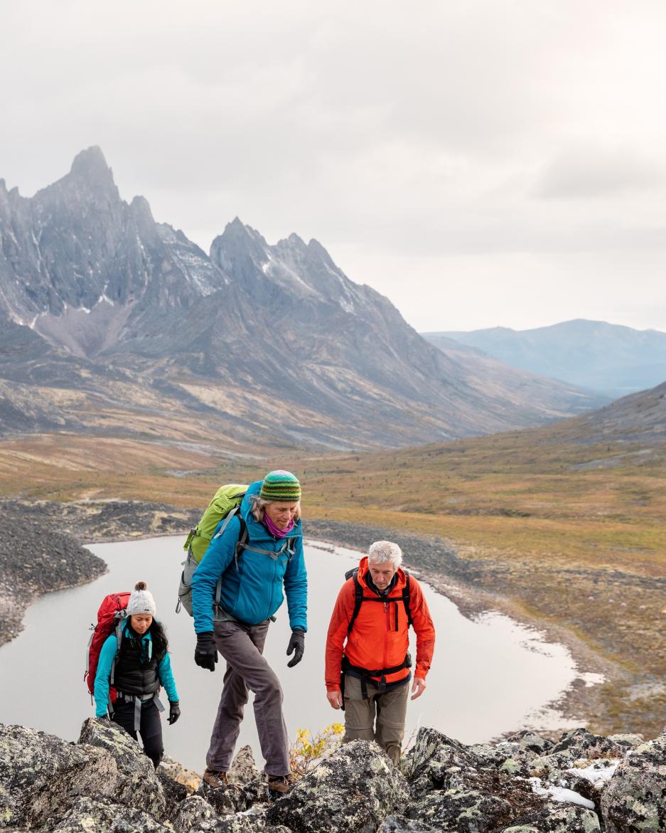 3 people hike in the tombstone mountains