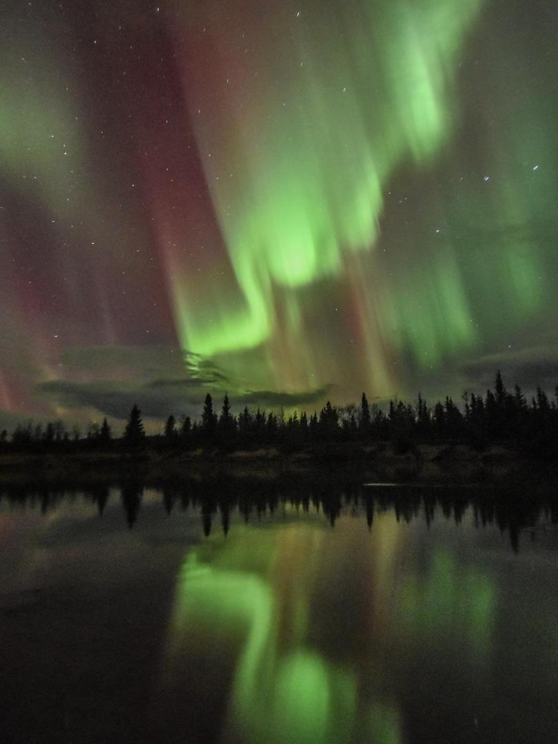 northern lights reflecting in Takhini River