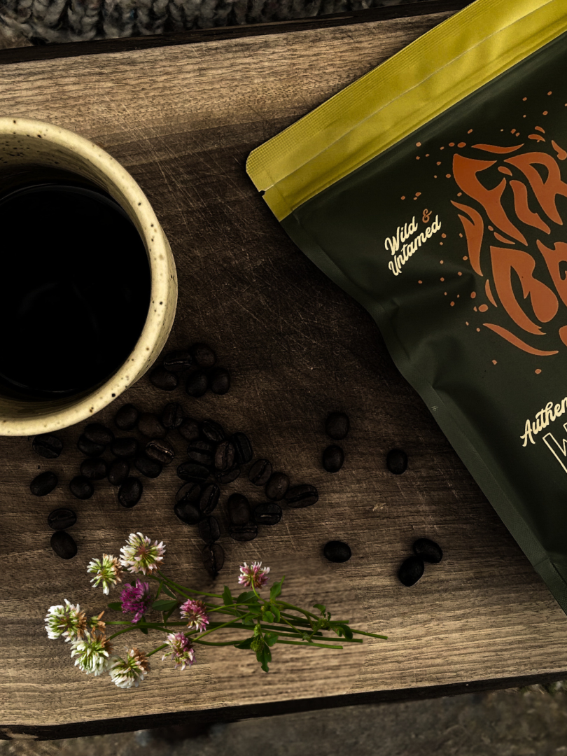 Firebean Coffee bag on a cutting board with a clay mug