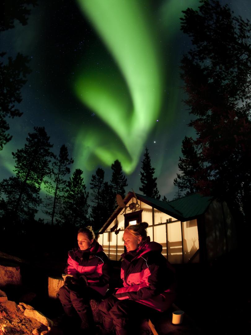Enjoy the Northern Lights and a cozy bonfire for an unforgettable Whitehorse experience.