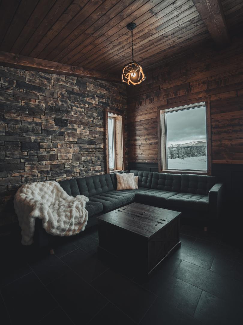 Cozy sofa in the corner of the cabin