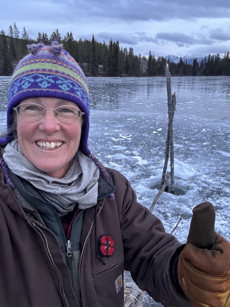 Woman is trapping with conibears.