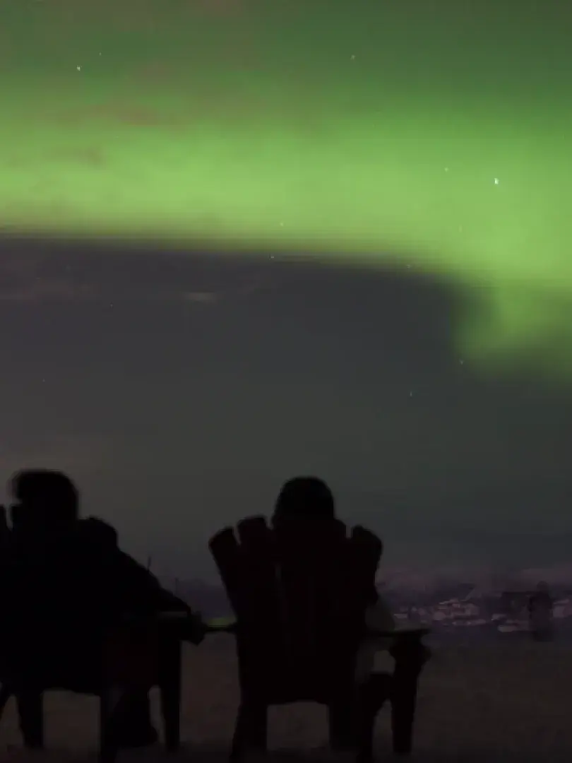 Northern lights above Whitehorse from top of Mount Sima