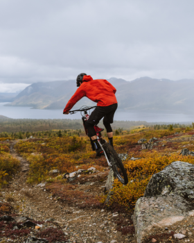 Person mountain biking