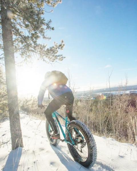 A person fatbiking along a mountain ridge