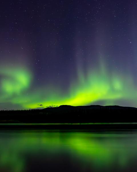 Northern lights reflecting on a lake.