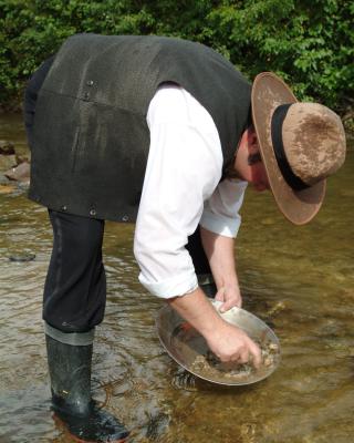 A person panning for gold in Free Claim #6 in Dawson City