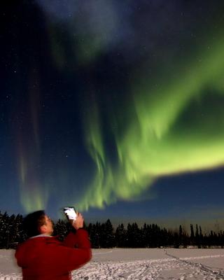 Very low lying aurora are visible at our viewing site