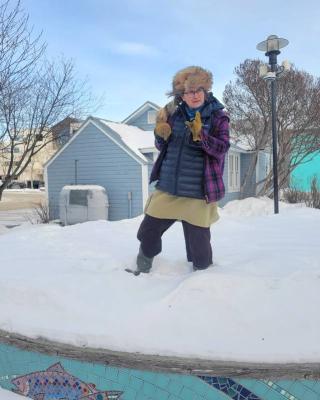 Tour guide and artist Nicole Bauberger tells animated stories on Chris Scherbarth's gorgeous mosaic stage in LePage Park