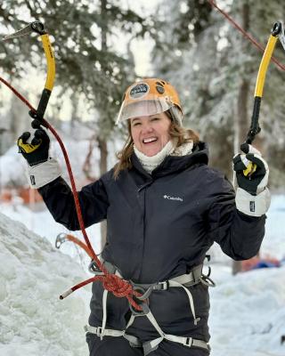 First time ice climber enjoying her winter experience
