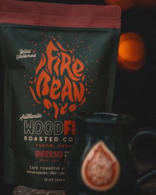 A bag of Firebean Coffee with a Fireglow in the background