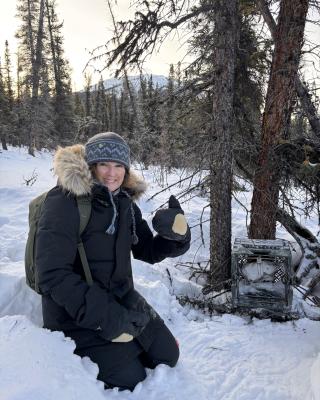 Woman is setting a trap.