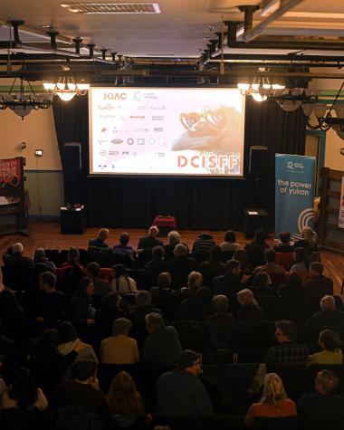 People gather in gerties to watch a movie