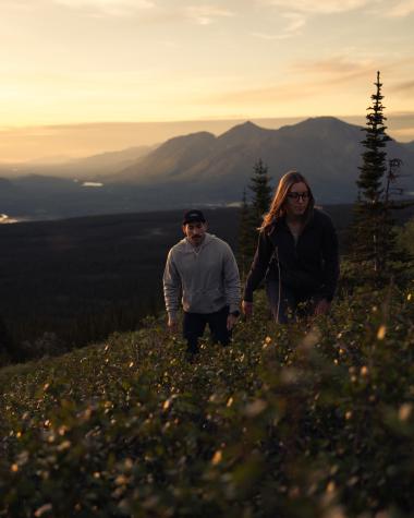 two people on a mountainside on summer solstice