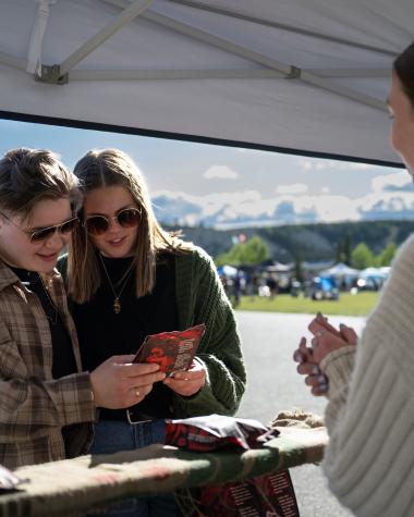 couple shopping at fireweed market in whitehorse
