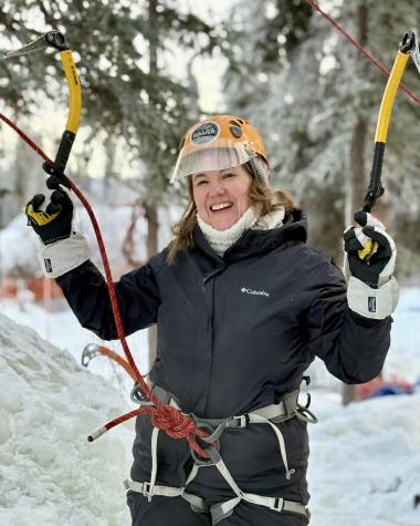 First time ice climber enjoying her winter experience
