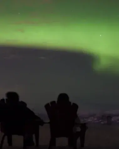 Northern lights above Whitehorse from top of Mount Sima